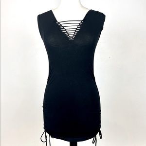 Custom sexy festival black mini dress. Cut outs. Adjustable ties. Worn once. M/L